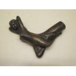 A bronzed walking stick handle in the form of a reclining Art Deco woman, 10cm x 10cm, in