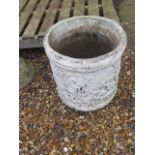 A stone effect garden planter, 44cm tall x 42cm