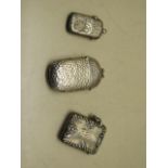 Three silver vesta cases, largest 6cm, total weight approx 1.8 troy oz, smallest has small dents and