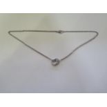 An 18ct white gold double hoop diamond pendant on an 18ct white gold double chain, 45cm long, approx