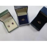 Two hallmarked 9ct gold amethyst rings, size P and G, and a pair of 9ct gold amethyst earrings,