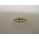 A hallmarked 18ct yellow gold three stone diamond ring, 0.25ct, ring size L/M, in good condition and