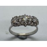 A hallmarked 18ct white gold cluster ring, size W, approx 5.7 grams, in good condition with minor