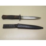 A WWI German trench knife with scabbard, some denting to scabbard but generally good condition