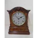 An 8 day walnut table clock by J.Caney Cheapside London with a fusee movement, 33cm tall, running,
