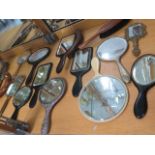 A collection of 16 hand mirrors and brushes