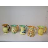 Five Burleigh bird, animal and dragon handle jugs, all good with some crazing