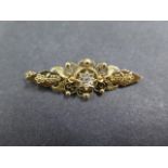 A 15ct gold and diamond pendant, possibly a brooch conversion, 4.5cm long, approx 3.8 grams, in good