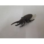 A bronze beetle, 8cm long