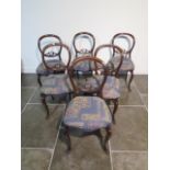 A set of six mahogany 19th century balloon back dining chairs on cabriole shaped legs, some old