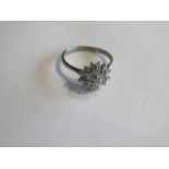 An 18ct white gold diamond cluster ring, size Q, head approx 10mm, approx 3.9 grams, diamonds bright