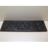 An 18th century carved Gothic oak panel, initialled FH to the back, 73cm x 21cm x 2.5cm