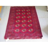 A hand knotted woollen Turkman rug, 1.5m x 1.24m in good condition