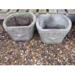 A pair of stone effect garden planters, 27cm tall x 37cm wide