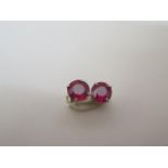 An pair of 18ct white gold ruby stud earrings, approx 1.5ct, hallmarked, in good condition