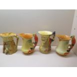 Four Burleigh ware jugs, rabbit jug crazed and chipped, piper jug crazed and cracked, the other