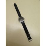 A Cyma WWW military manual wind wristwatch, one of the Dirty Dozen military watches, dust cover with