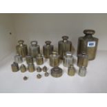 A collection of 22 assorted brass weights ranging from 5kg to 5 grams