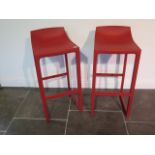 A pair of Vondow Wall St by Eugeni Quitllet red moulded bar stools, 87cm tall x 39cm wide, for