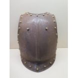 A 19th century French cavalry plate, 46cm x 33cm, has been drilled for wall mounting, some pitting