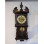 An 8 day Austrian wallclock, strikes hours and half hours, 70cm tall with key, running