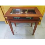 A modern mahogany bijouterie display table 70cm tall x 70cm x 46cm, in good condition