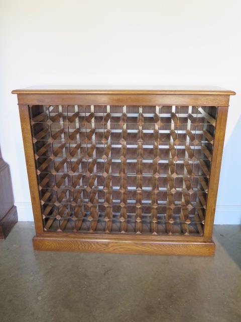 A burr oak 80 bottle wine rack made by a local craftsman to a high standard, 98cm tall x 111cm