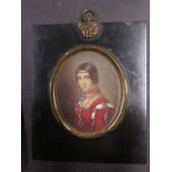 A signed watercolour portrait in a 19th century and later frame, frame size 15cm x 12cm