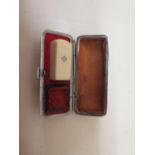 A Chinese 19th century ivory small seal in original leather box, length 3cm, some wear to top of box