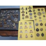 A collection of 85 military badges