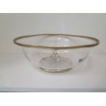 A late 19th century glass bowl with gilt cypher and rim, 39.5cm diameter, 14.5cm high, large chip to