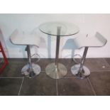 A glass top bar table, 91cm tall x 60cm diameter with two white laminated gas lift stools, some