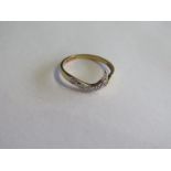 A 9ct yellow gold diamond ring, not hallmarked but old, test mark to inside of shank, size N, approx