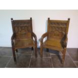 A near pair of Gothic type open throne chairs, 114cm tall x 67cm x 52cm deep, both in good sturdy