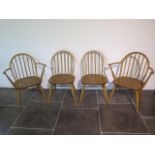 A set of four blonde Ercol Windsor chairs, two being carvers, in clean original condition