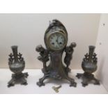 An Art Noveau style three piece garniture 8 day movement, strikes on bell, 38cm tall, with key,