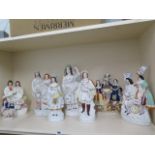 A collection of eight Staffordshire figures, tallest 41cm high, all have crazing with some small