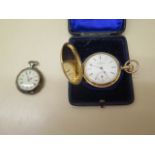 A gold filled or gold plated Elgin full hunter pocket watch with white enamel face and subsidiary