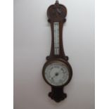 An oak barometer with thermometer, 82cm tall
