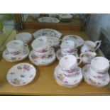 A collection of Royal Crown Derby Derby posies, 6 small cups and 9 saucers, 3 large cups, 5