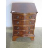 A mahogany effect four drawer bedside chest in good condition, 61cm tall x 41cm x 36cm
