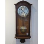 An early 20th century oakcase wallclock, 8 day strikes hours/half, 87cm tall, in running order