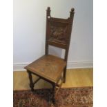 A Victorian carved oak hall chair, 108cm tall x 46cm wide