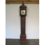 An oak carved 30 hour single hand longcase clock, the dial signed Wm Russell Wootton, with a 8"