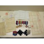 A group of WWII medals (unnamed) and various documents, badges relating to Pte James Roland Brown