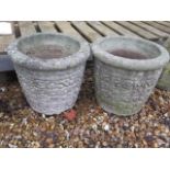 A pair of stone effect garden planters, 32cm tall x 35cm wide