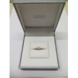 An 18ct white gold diamond solitaire ring, 0.37ct, with diamond shoulders, IGI certificate,