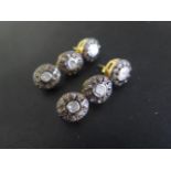 A pair of gilt three stone rough cut diamond earrings, 3.5cm long, in good condition