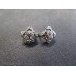 A pair of 14ct white gold diamond cluster earrings, 10mm x 10mm, approx 5.6 grams, in good condition