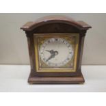 An 8 day mantel clock by Elliott of London, 18cm tall, running